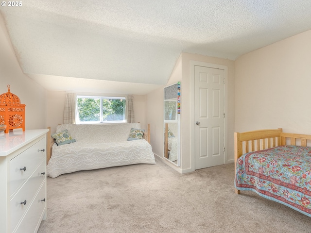 3843 SE 41st Ave SE, Portland, OR 97202 - carpeted bedroom featuring a textured ceiling and vaulted ceiling