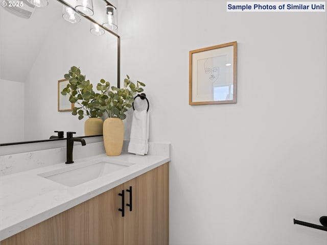 1218 SE Center St Unit 3, Portland, OR 97202 - bathroom featuring vanity and vaulted ceiling