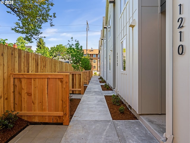 1218 SE Center St Unit 3, Portland, OR 97202 - view of side of home featuring fence and board and batten siding