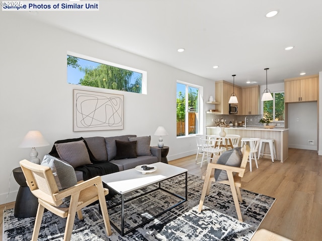 1218 SE Center St Unit 3, Portland, OR 97202 - living area featuring baseboards, recessed lighting, and light wood-type flooring