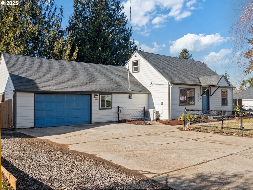 view of front of property featuring ac unit, roof with shingles, an attached garage, fence, and driveway