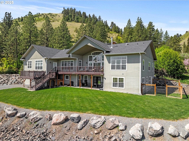 217 Deal Canyon Rd, La Grande, OR 97850 - back of property featuring a deck, stairs, and a patio area