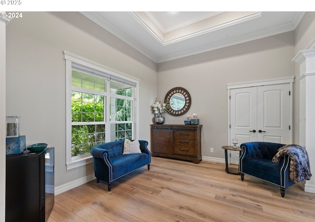 217 Deal Canyon Rd, La Grande, OR 97850 - living area with crown molding, light wood-style flooring, baseboards, and a raised ceiling