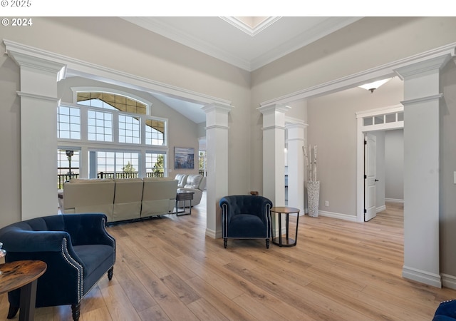 217 Deal Canyon Rd, La Grande, OR 97850 - living area with ornate columns, light wood-type flooring, ornamental molding, baseboards, and a towering ceiling