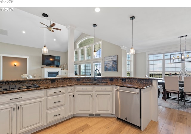 217 Deal Canyon Rd, La Grande, OR 97850 - kitchen featuring a sink, stainless steel dishwasher, stovetop with downdraft, a ceiling fan, and a fireplace