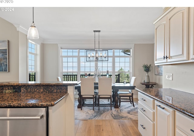 217 Deal Canyon Rd, La Grande, OR 97850 - kitchen with light wood-type flooring, ornamental molding, plenty of natural light, hanging light fixtures, and dark stone counters