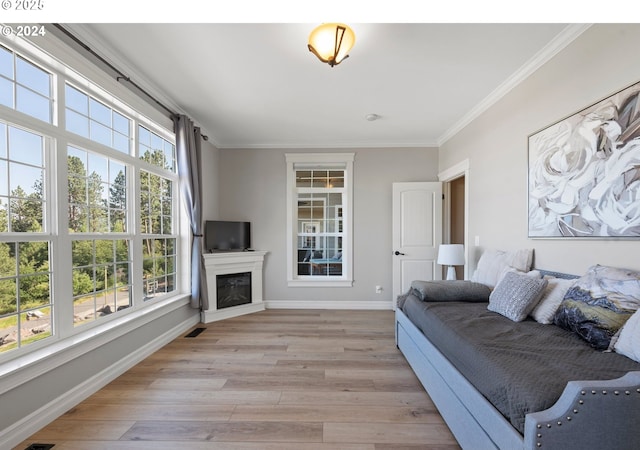 217 Deal Canyon Rd, La Grande, OR 97850 - living room with light wood-type flooring, crown molding, baseboards, and a fireplace