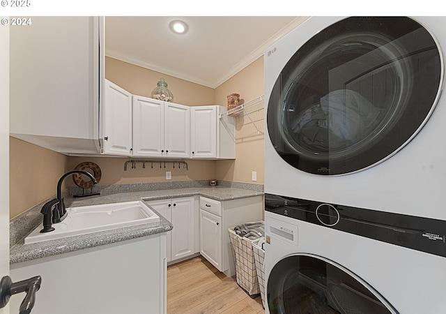 217 Deal Canyon Rd, La Grande, OR 97850 - laundry room with stacked washer / dryer, crown molding, cabinet space, light wood finished floors, and recessed lighting