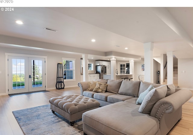217 Deal Canyon Rd, La Grande, OR 97850 - living room with decorative columns, light wood-style floors, french doors, baseboards, and recessed lighting