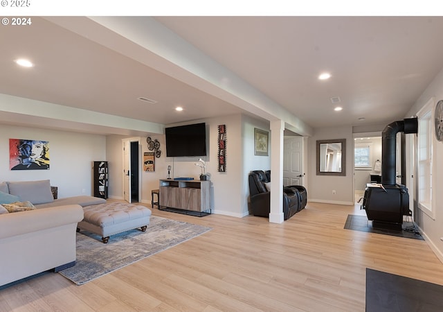 217 Deal Canyon Rd, La Grande, OR 97850 - living area with a wood stove, light wood-type flooring, recessed lighting, and baseboards