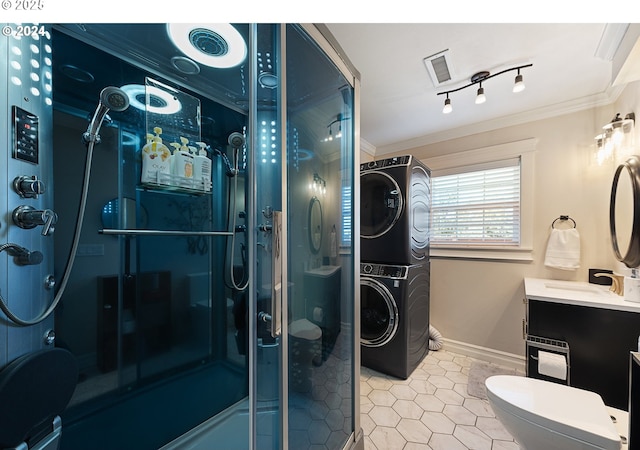217 Deal Canyon Rd, La Grande, OR 97850 - full bath featuring stacked washer and clothes dryer, tile patterned floors, a shower stall, vanity, and toilet