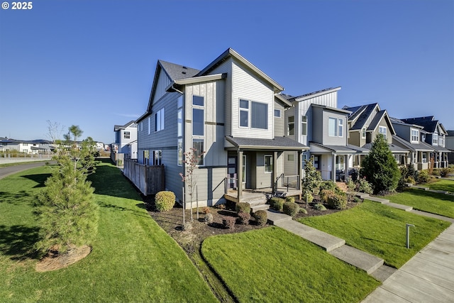 view of front of house with a residential view and a front lawn