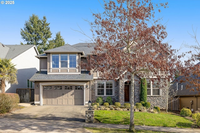 view of front of house with a garage and a front yard