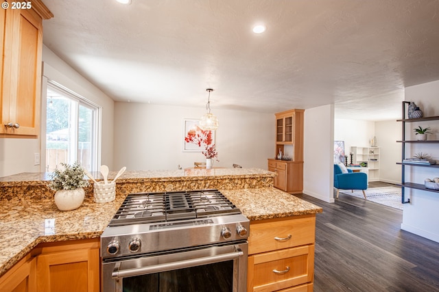 2250 Jeppesen Acres Rd, Eugene, OR 97401 - kitchen featuring gas stove, dark wood-style flooring, baseboards, a peninsula, and hanging light fixtures