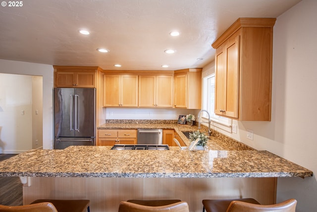 2250 Jeppesen Acres Rd, Eugene, OR 97401 - kitchen with appliances with stainless steel finishes, a peninsula, a sink, recessed lighting, and light brown cabinets
