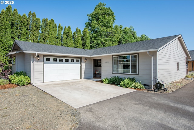 2250 Jeppesen Acres Rd, Eugene, OR 97401 - single story home featuring concrete driveway, a garage, and roof with shingles