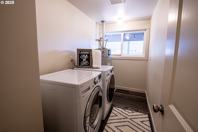 2250 Jeppesen Acres Rd, Eugene, OR 97401 - washroom with independent washer and dryer, dark wood finished floors, baseboards, and secured water heater