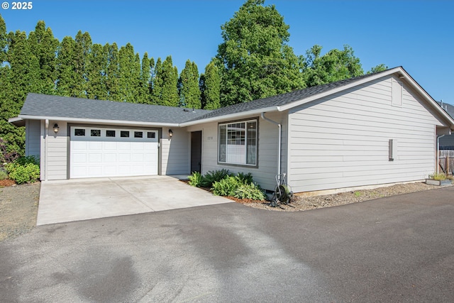 2250 Jeppesen Acres Rd, Eugene, OR 97401 - ranch-style house with an attached garage, concrete driveway, and a shingled roof