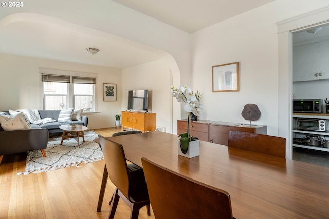 dining area featuring wood-type flooring