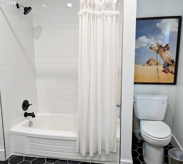 bathroom featuring toilet, shower / bath combo with shower curtain, and tile patterned flooring