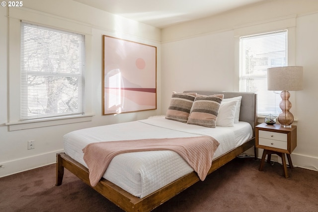 bedroom with dark carpet