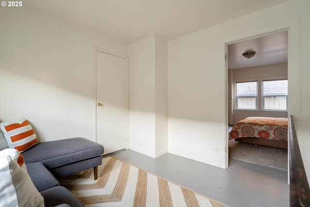 sitting room with concrete flooring