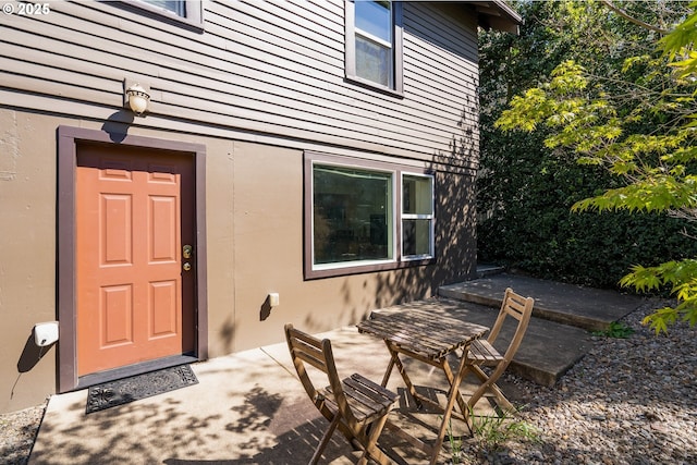 doorway to property with a patio