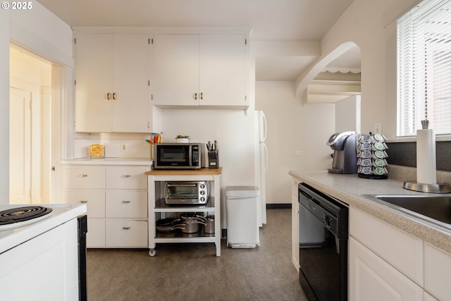 kitchen featuring white cabinetry, sink, and black dishwasher