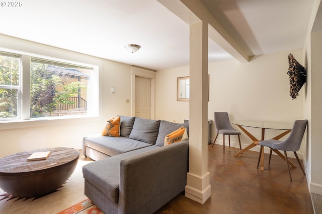 living room with beam ceiling