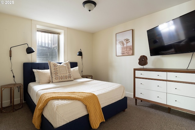 bedroom featuring dark colored carpet