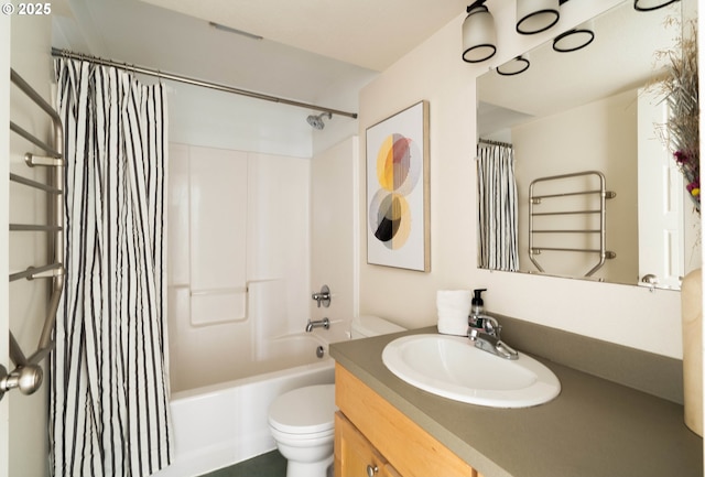 full bathroom featuring vanity, shower / bath combination with curtain, and toilet