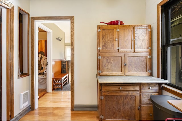 corridor featuring light hardwood / wood-style floors