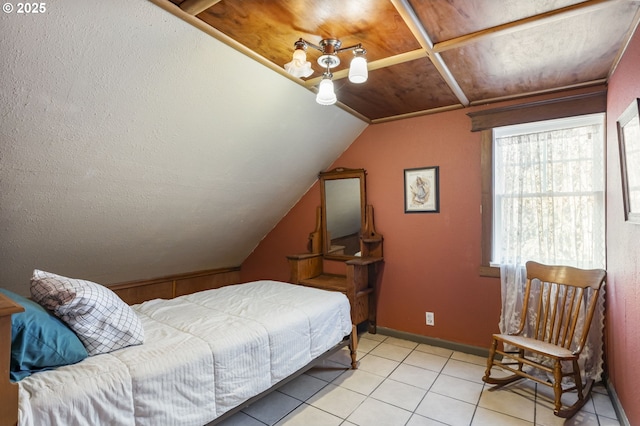 bedroom featuring light tile patterned floors, lofted ceiling, and wood ceiling