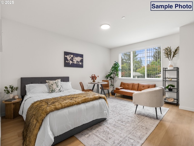 10985 E Burnside St Unit 3, Portland, OR 97216 - bedroom featuring baseboards and wood finished floors