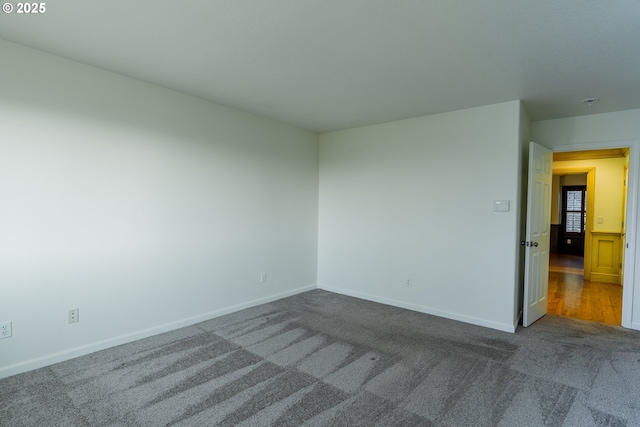 unfurnished room featuring carpet floors