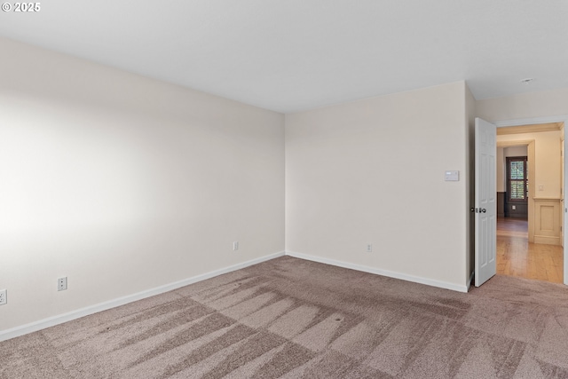 empty room with light colored carpet