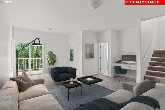 living room with plenty of natural light and carpet floors