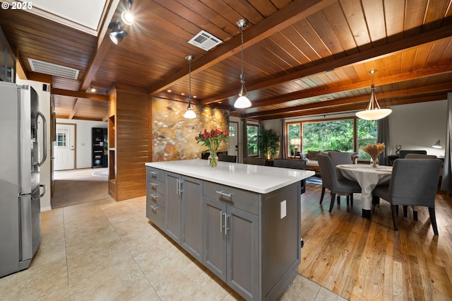 3144 Diane Dr, Lake Oswego, OR 97035 - kitchen featuring gray cabinets, freestanding refrigerator, wood ceiling, light countertops, and beamed ceiling