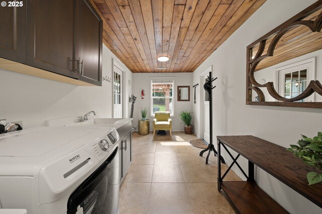 3144 Diane Dr, Lake Oswego, OR 97035 - clothes washing area with wooden ceiling, cabinet space, light tile patterned floors, and independent washer and dryer