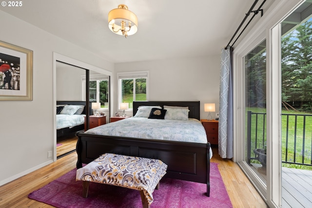 3144 Diane Dr, Lake Oswego, OR 97035 - bedroom with light wood-type flooring, access to exterior, and baseboards