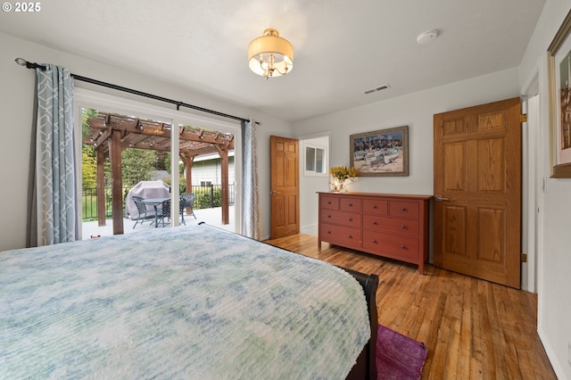 3144 Diane Dr, Lake Oswego, OR 97035 - bedroom with wood-type flooring, access to outside, and a chandelier