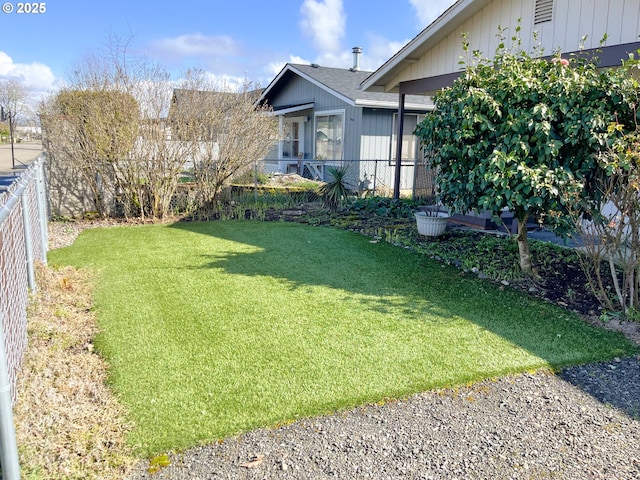 view of yard with a fenced backyard