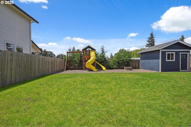 655 Schemmel Ln, Silverton, OR 97381 - fenced backyard featuring a playground and an outdoor structure