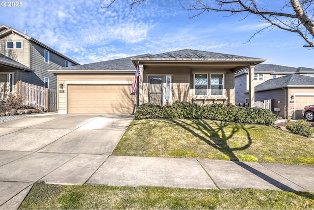 view of front of house featuring a garage and a front yard