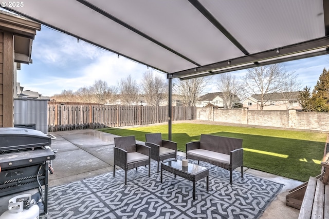 view of patio featuring a grill