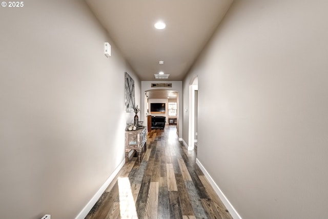 hall with dark hardwood / wood-style floors