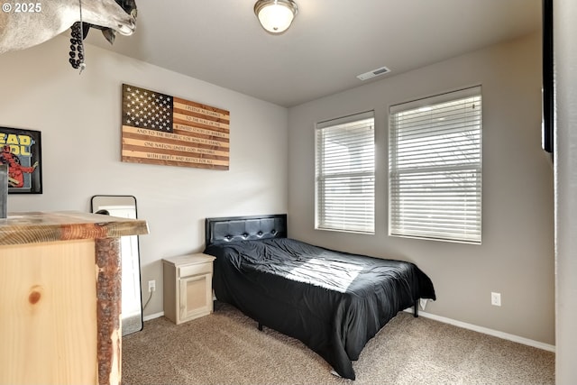 bedroom featuring light carpet