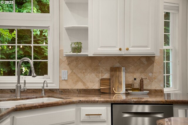 4503 NW 147th Ave, Portland, OR 97229 - kitchen featuring a sink, dishwasher, white cabinetry, and tasteful backsplash