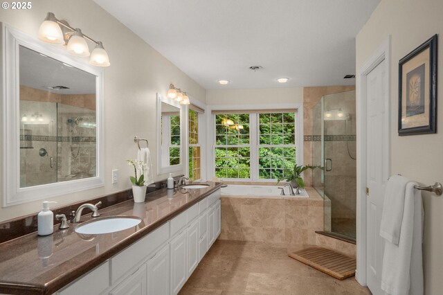 4503 NW 147th Ave, Portland, OR 97229 - full bath featuring double vanity, a bath, a shower stall, and tile patterned flooring