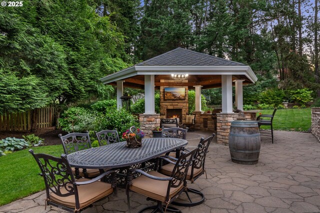 4503 NW 147th Ave, Portland, OR 97229 - view of patio / terrace with an outdoor stone fireplace, a gazebo, and outdoor dining area